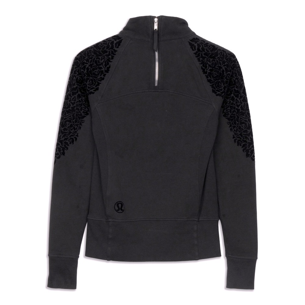 Lulu lemon fleece pullover fits size small Black with Floral details pockets